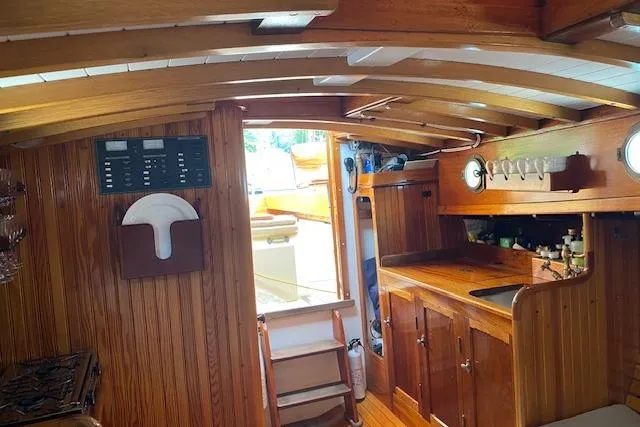 Ilona Yacht Photos Pics Interior of a 2005 Custom Gannon & Benjamin boat with wooden cabinetry and nautical decor.