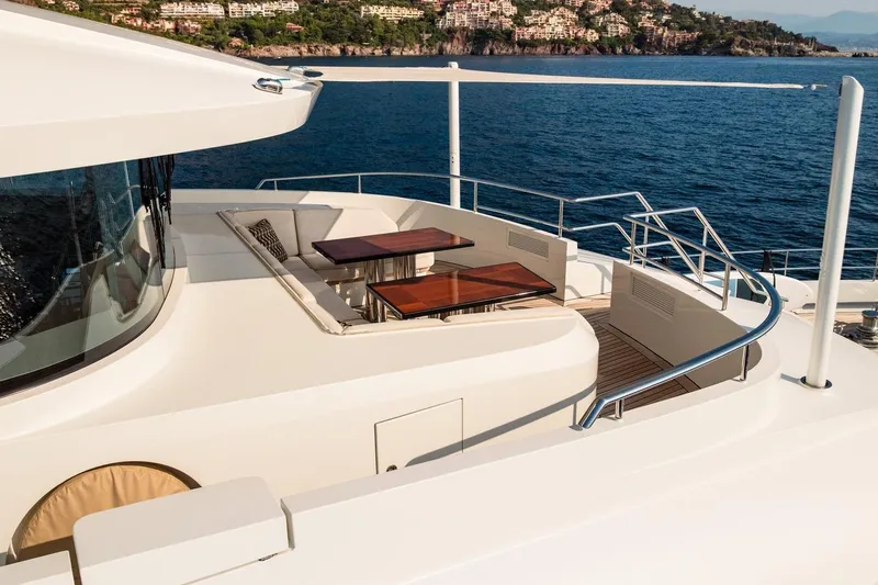 Kokoro Yacht Photos Pics Luxurious 2020 Moonen Martinique YN1 yacht deck with elegant seating and ocean view.