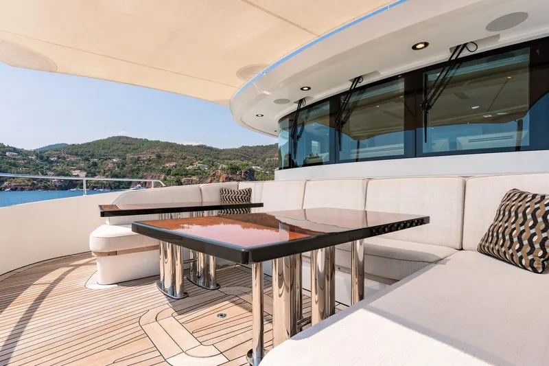 Kokoro Yacht Photos Pics Luxurious 2020 Moonen Martinique YN1 yacht deck with elegant seating and scenic ocean view.