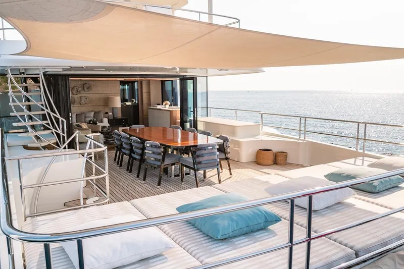 Kokoro Yacht Photos Pics Luxurious 2020 Moonen Martinique YN1 yacht deck with dining area and ocean view.