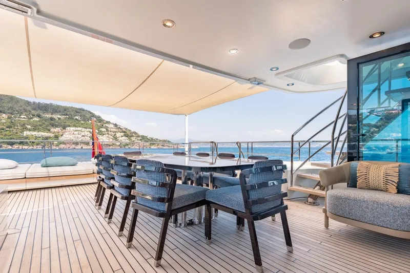 Kokoro Yacht Photos Pics Luxurious deck of 2020 Moonen Martinique YN1 yacht with ocean view and elegant seating.