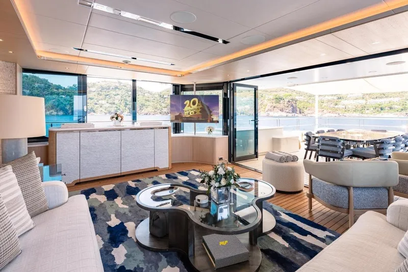 Kokoro Yacht Photos Pics Luxurious interior of 2020 Moonen Martinique YN1 yacht with elegant furnishings and scenic ocean view.
