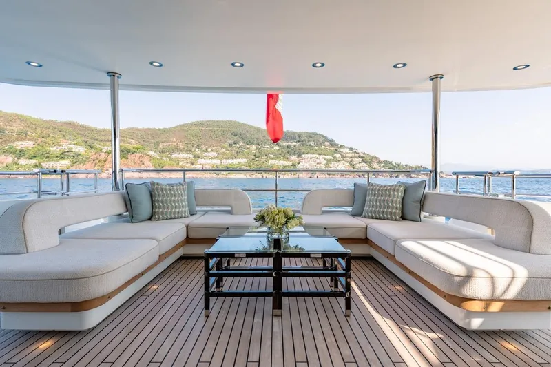 Kokoro Yacht Photos Pics Luxurious 2020 Moonen Martinique YN1 yacht deck with elegant seating and scenic ocean view.