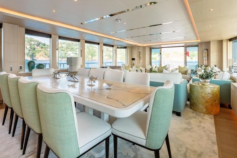 Kokoro Yacht Photos Pics Luxurious interior of 2020 Moonen Martinique YN1 yacht with elegant dining area and scenic views.