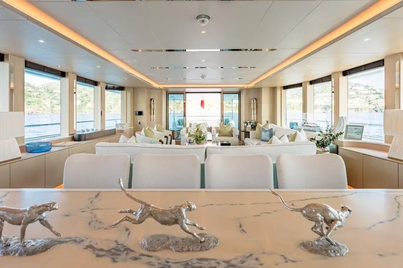 Kokoro Yacht Photos Pics Luxurious interior of 2020 Moonen Martinique YN1 yacht with elegant decor and panoramic windows.