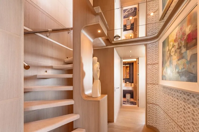 Kokoro Yacht Photos Pics Luxurious interior of 2020 Moonen Martinique YN1 yacht with elegant staircase and modern decor.