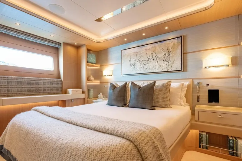Kokoro Yacht Photos Pics Luxurious bedroom interior on 2020 Moonen Martinique YN1 yacht, featuring elegant decor and modern amenities.
