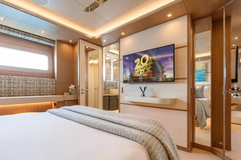 Kokoro Yacht Photos Pics Luxurious bedroom interior on 2020 Moonen Martinique YN1 yacht, featuring modern design and entertainment system.
