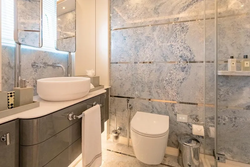 Kokoro Yacht Photos Pics Luxurious bathroom on 2020 Moonen Martinique YN1 yacht with elegant fixtures and marble accents.