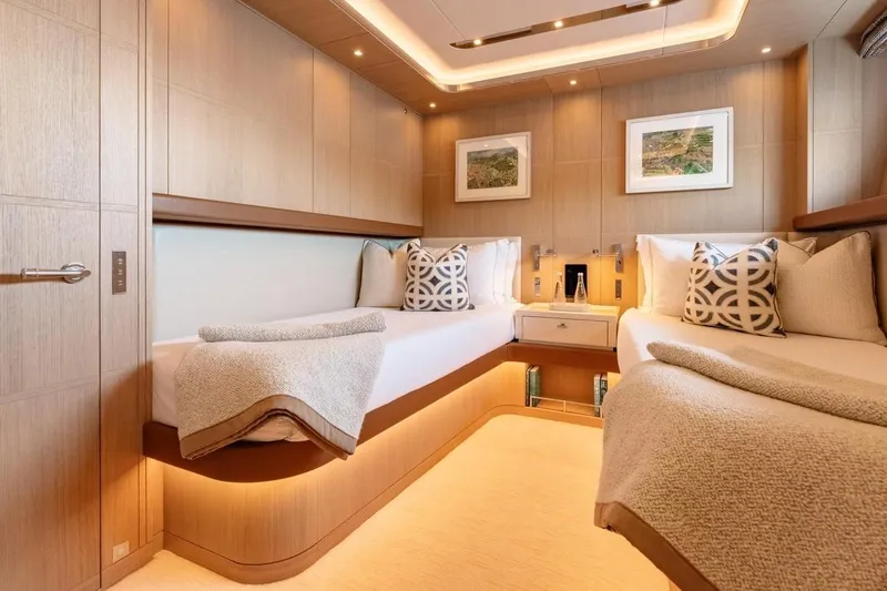 Kokoro Yacht Photos Pics Luxurious cabin interior of 2020 Moonen Martinique YN1 yacht with twin beds and elegant decor.