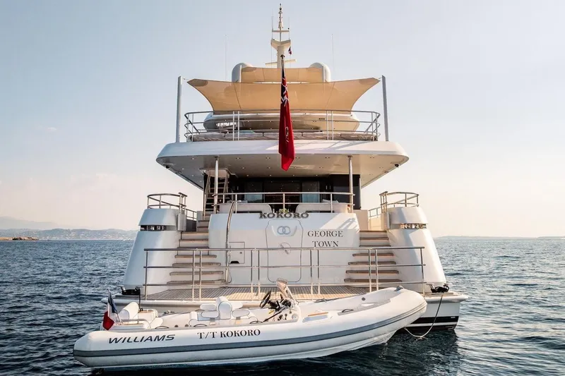 Kokoro Yacht Photos Pics Luxury yacht Moonen Martinique YN1, 2020, with tender boat, anchored in serene waters.