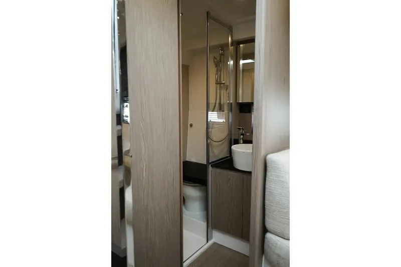  Yacht Photos Pics Modern bathroom interior of 2024 Azimut Atlantis 45 yacht, featuring sleek design and fixtures.