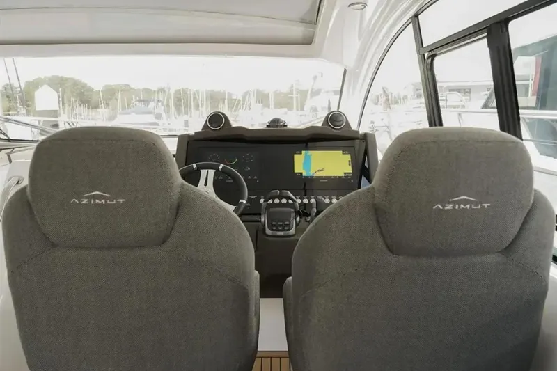  Yacht Photos Pics 2024 Azimut Atlantis 45 yacht cockpit with dual seats and advanced navigation system.