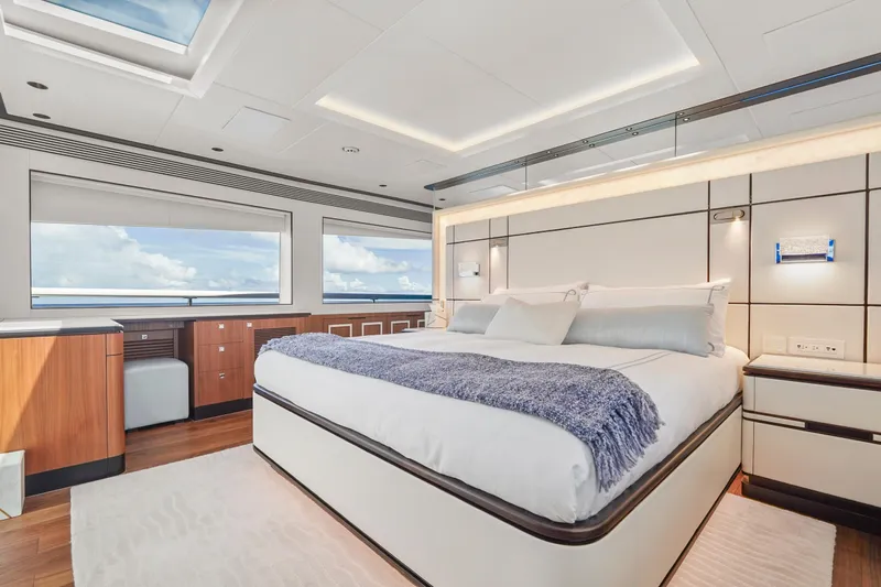 Miss Michelle Yacht Photos Pics Luxurious bedroom interior on 2025 Horizon 122RP yacht with ocean view and modern design.