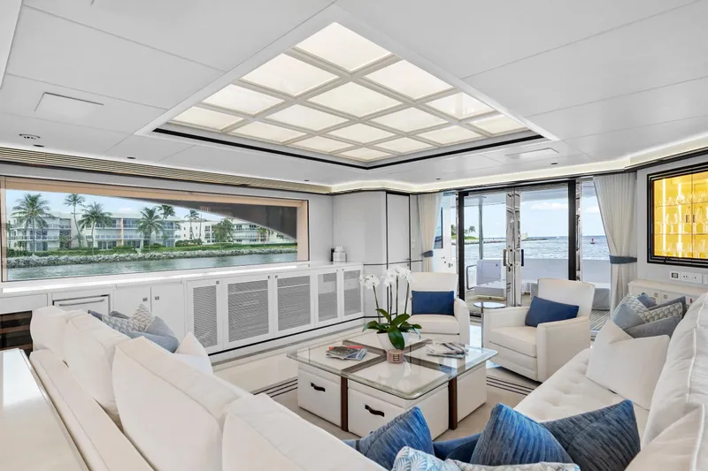Miss Michelle Yacht Photos Pics Luxurious interior of 2025 Horizon 122RP yacht with elegant seating and ocean view.