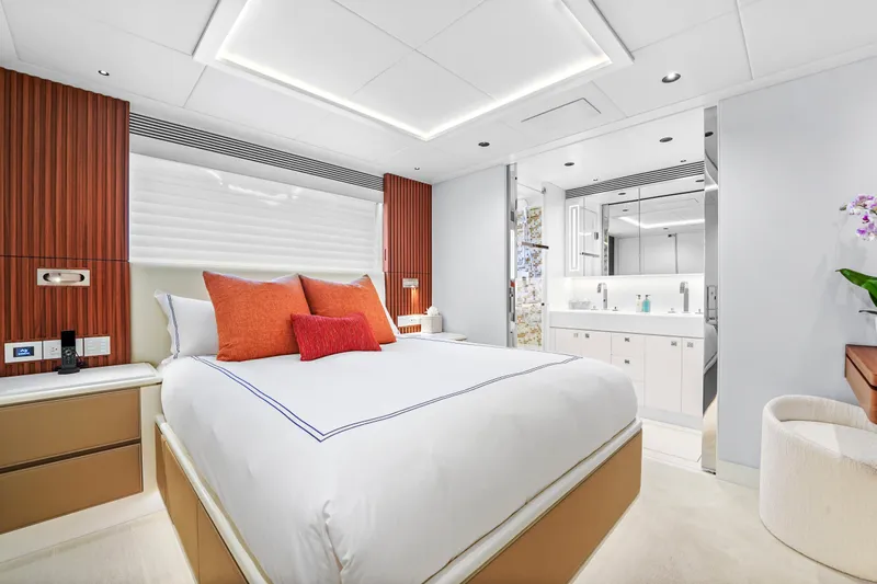 Miss Michelle Yacht Photos Pics Luxurious bedroom interior of 2025 Horizon 122RP yacht with modern design and elegant furnishings.