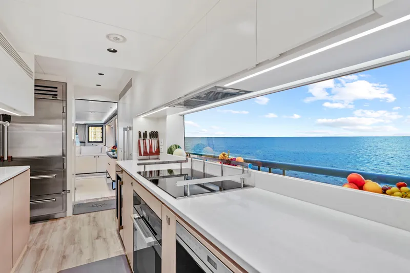 Miss Michelle Yacht Photos Pics Modern kitchen on Horizon 122RP yacht, 2025 model, with ocean view and sleek design.