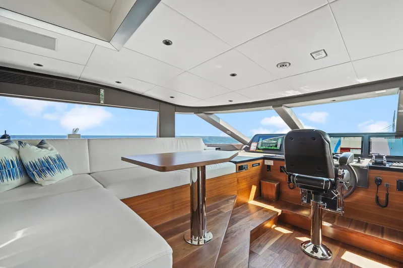 Miss Michelle Yacht Photos Pics Luxurious 2025 Horizon 122RP yacht interior with modern helm, plush seating, and ocean view.