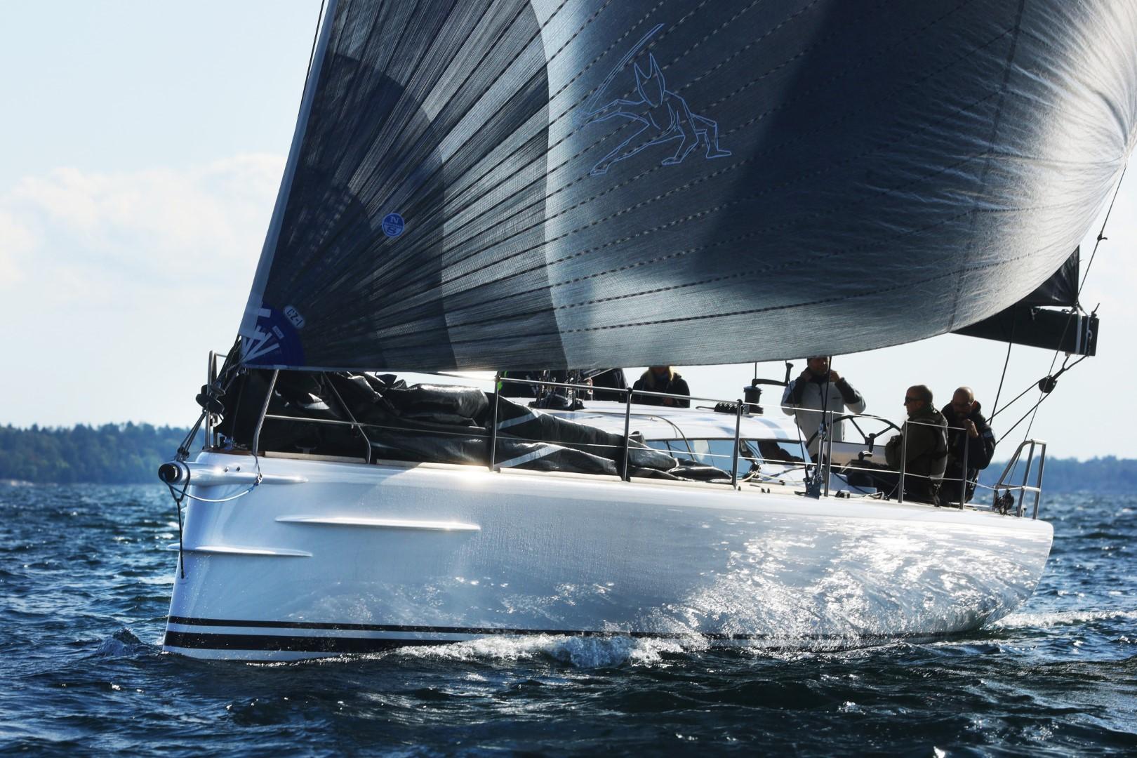 2024 Shogun 50 sailboat gliding on open water with crew onboard.