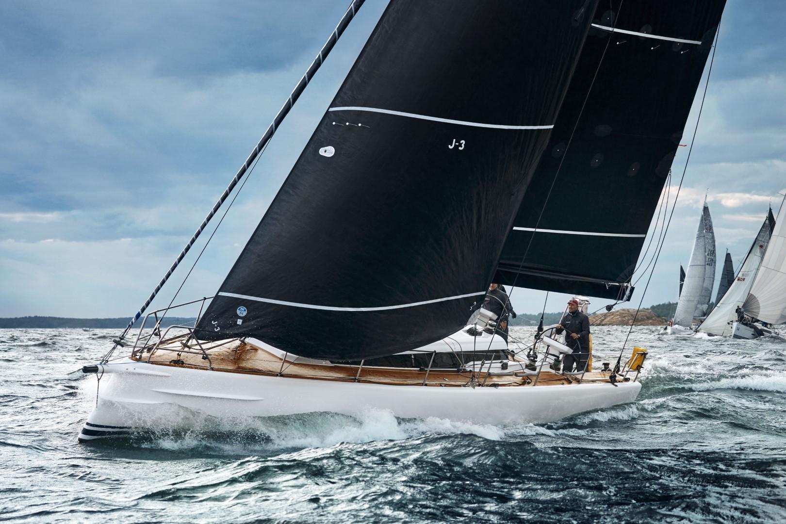 2024 Shogun 50 sailboat navigating choppy waters under a cloudy sky.