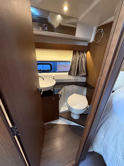  Yacht Photos Pics 2021 Jeanneau NC Weekender 1095 bathroom with sink, toilet, and window.