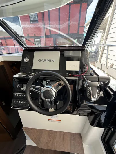  Yacht Photos Pics 2021 Jeanneau NC Weekender 1095 helm with Garmin navigation system.