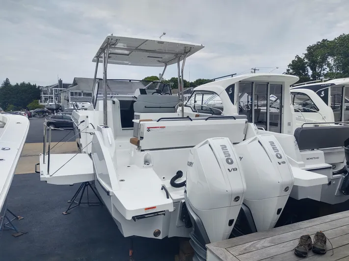 Paul's Legacy Yacht Photos Pics 2023 Beneteau Flyer 9 SUNdeck with dual outboard engines, docked at a marina.