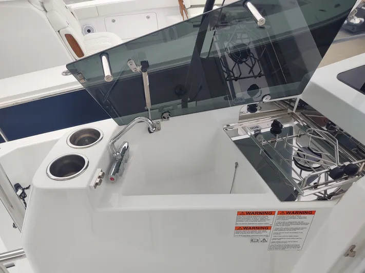 Paul's Legacy Yacht Photos Pics 2023 Beneteau Flyer 9 SUNdeck boat kitchen area with sink and stove.