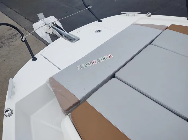 Paul's Legacy Yacht Photos Pics 2023 Beneteau Flyer 9 SUNdeck boat with cushioned seating and anchor.