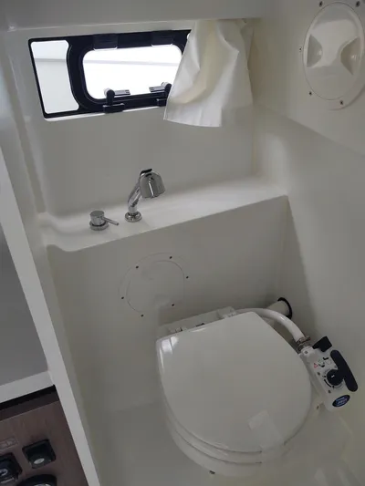 Paul's Legacy Yacht Photos Pics 2023 Beneteau Flyer 9 SUNdeck bathroom with compact toilet and sink.