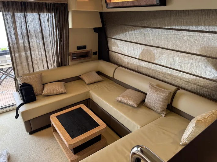 Miss Understood Yacht Photos Pics Luxurious interior of 2015 Azimut 64 yacht with beige seating and elegant decor.