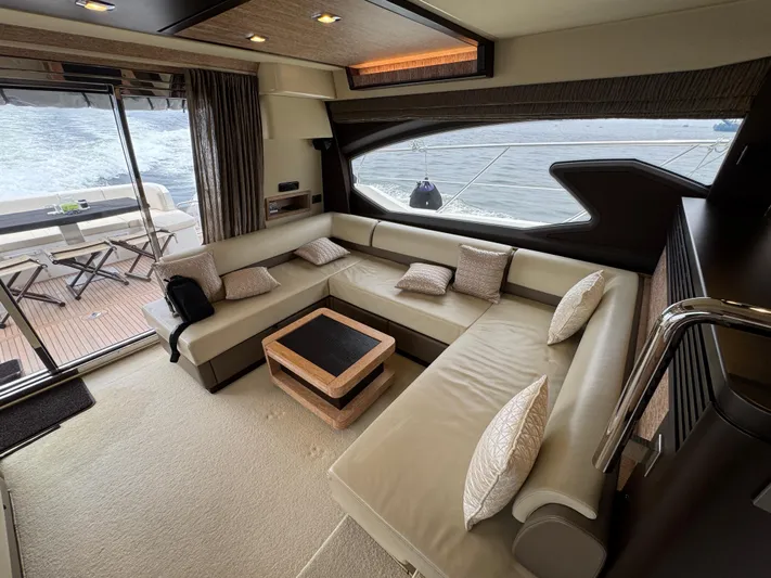 Miss Understood Yacht Photos Pics Luxurious interior of 2015 Azimut 64 yacht with spacious seating and ocean view.