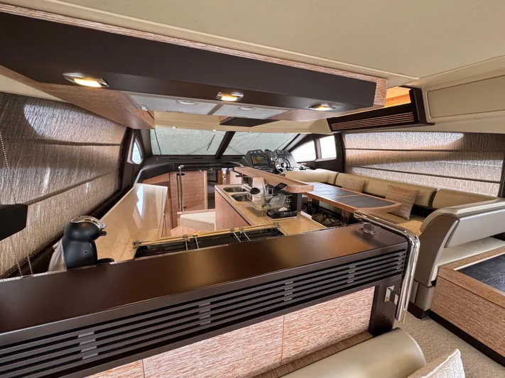 Miss Understood Yacht Photos Pics Luxurious interior of a 2015 Azimut 64 yacht with modern furnishings and sleek design.