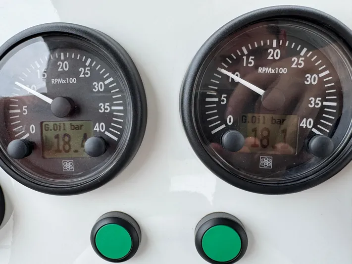 Miss Understood Yacht Photos Pics Close-up of Azimut 64 yacht gauges displaying RPM and oil pressure readings.