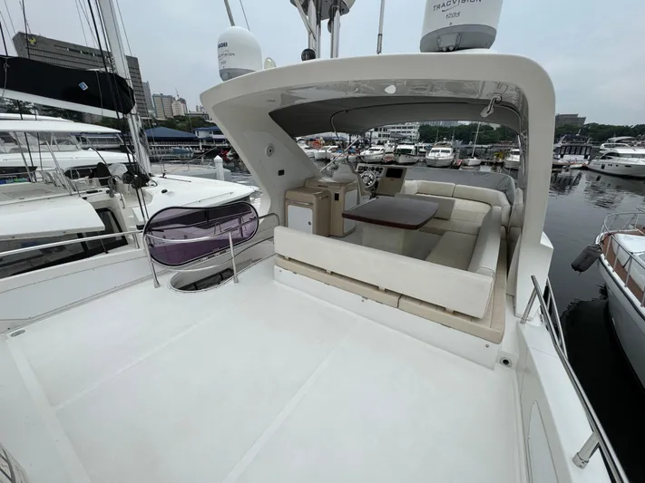 Miss Understood Yacht Photos Pics Luxurious 2015 Azimut 64 yacht with spacious deck and seating area at marina.