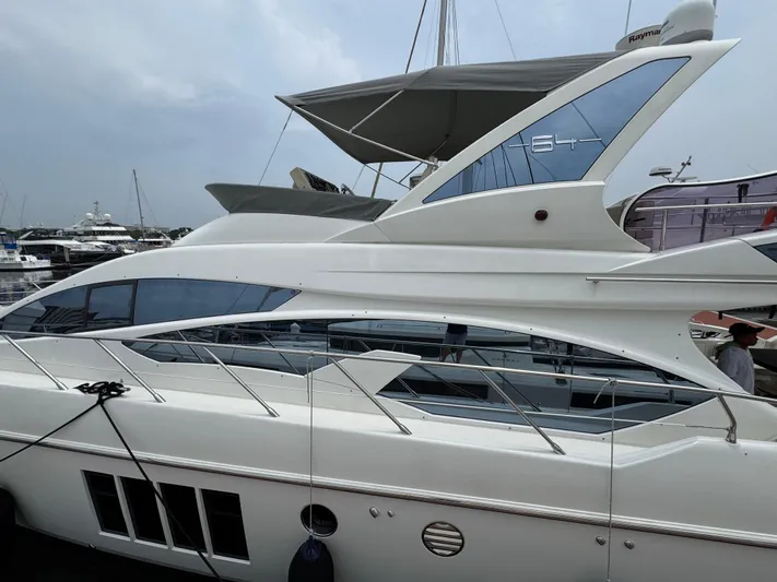 Miss Understood Yacht Photos Pics 2015 Azimut 64 yacht docked at marina, showcasing sleek design and modern features.