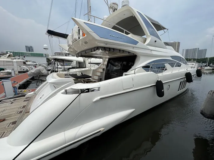 Miss Understood Yacht Photos Pics Luxury 2015 Azimut 64 yacht docked at marina, showcasing sleek design and modern features.