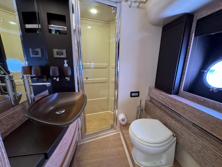 Miss Understood Yacht Photos Pics Luxurious bathroom in 2015 Azimut 64 yacht with modern fixtures and elegant design.