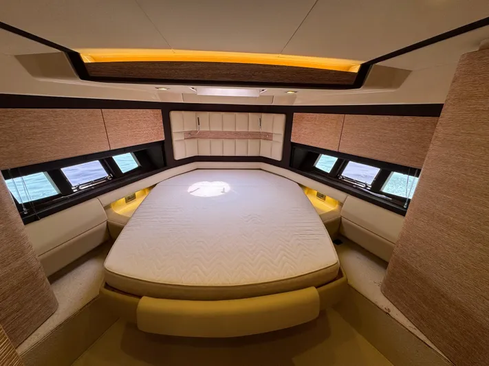 Miss Understood Yacht Photos Pics Luxurious bedroom interior of 2015 Azimut 64 yacht with elegant design and ample natural light.