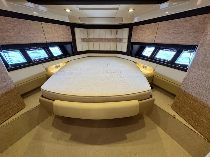 Miss Understood Yacht Photos Pics Luxurious bedroom interior of 2015 Azimut 64 yacht with elegant design and ample natural light.