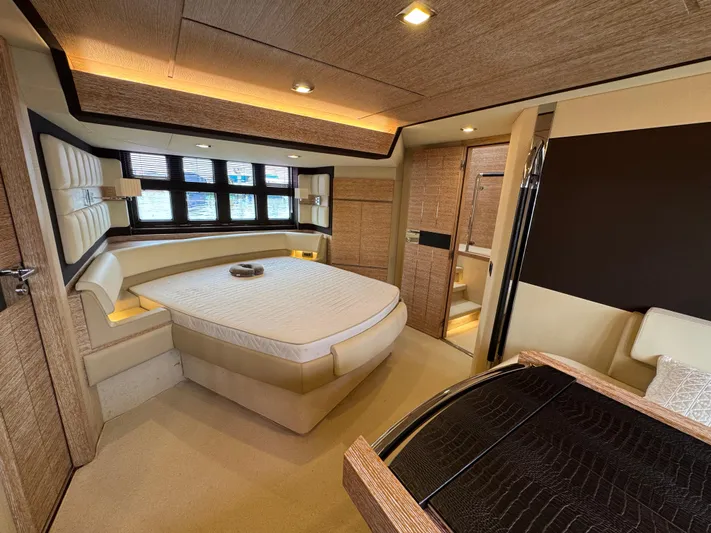 Miss Understood Yacht Photos Pics Luxurious interior of a 2015 Azimut 64 yacht with elegant wood finishes and modern design.