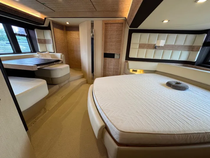 Miss Understood Yacht Photos Pics Luxurious interior of a 2015 Azimut 64 yacht with elegant seating and bedding.