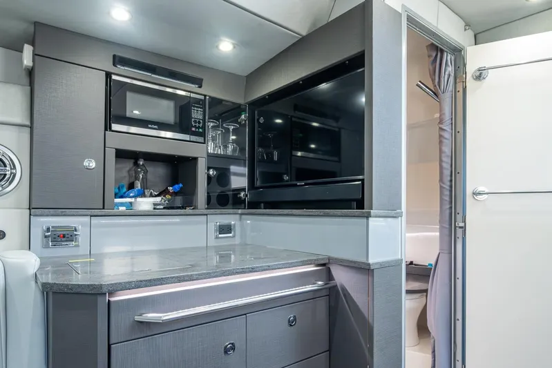  Yacht Photos Pics 2019 Formula 430 Super Sport Crossover interior kitchen with modern appliances.