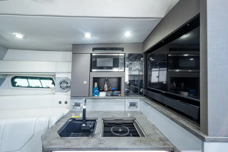  Yacht Photos Pics Luxurious interior of 2019 Formula 430 Super Sport Crossover yacht kitchen area.