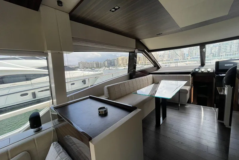  Yacht Photos Pics Luxurious interior of 2021 Ferretti Yachts 670 with modern seating and panoramic windows.
