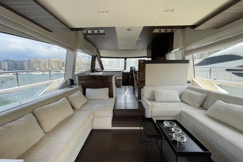 Yacht Photos Pics Luxurious interior of 2021 Ferretti Yachts 670 with elegant seating and panoramic windows.
