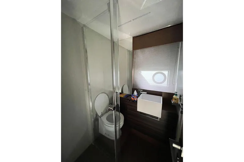  Yacht Photos Pics Modern bathroom interior on 2021 Ferretti Yachts 670, featuring sleek design and compact amenities.