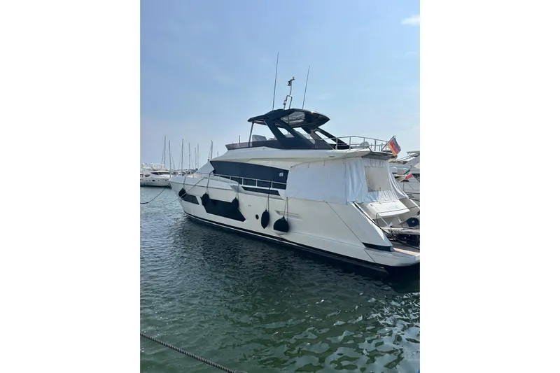  Yacht Photos Pics 2021 Ferretti Yachts 670 docked in marina, showcasing sleek design and modern features.