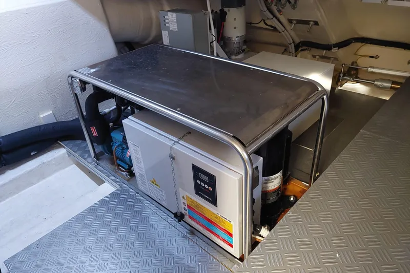  Yacht Photos Pics Engine room of 2021 Ferretti Yachts 670, featuring mechanical equipment and control panel.