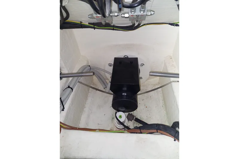  Yacht Photos Pics Engine compartment of 2021 Ferretti Yachts 670, showcasing mechanical components and wiring.